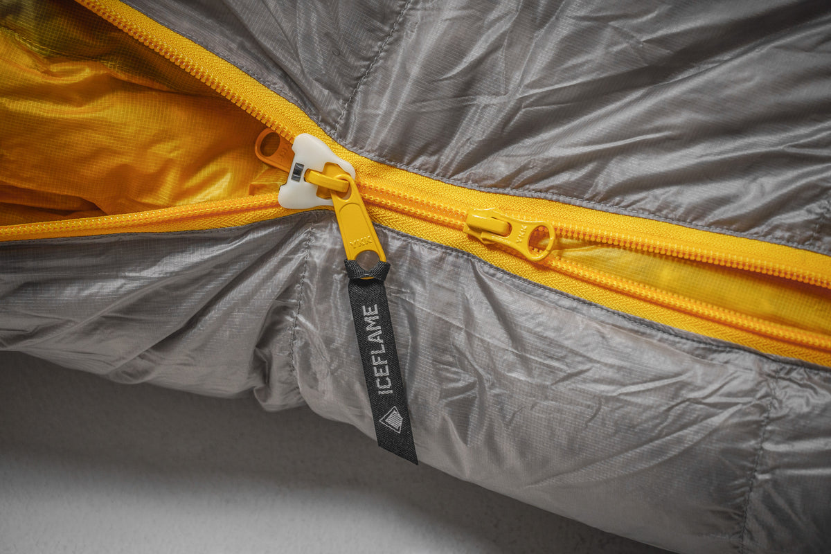 Iceflame sleeping bag camping detail – yellow lining and branding