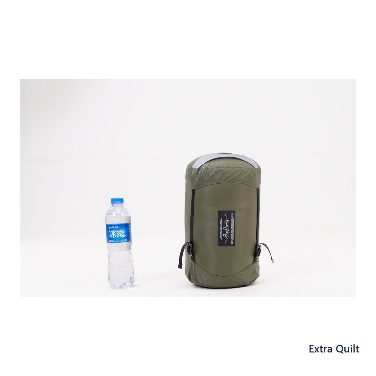 Iceflame Extra Quilt compression bag beside a water bottle