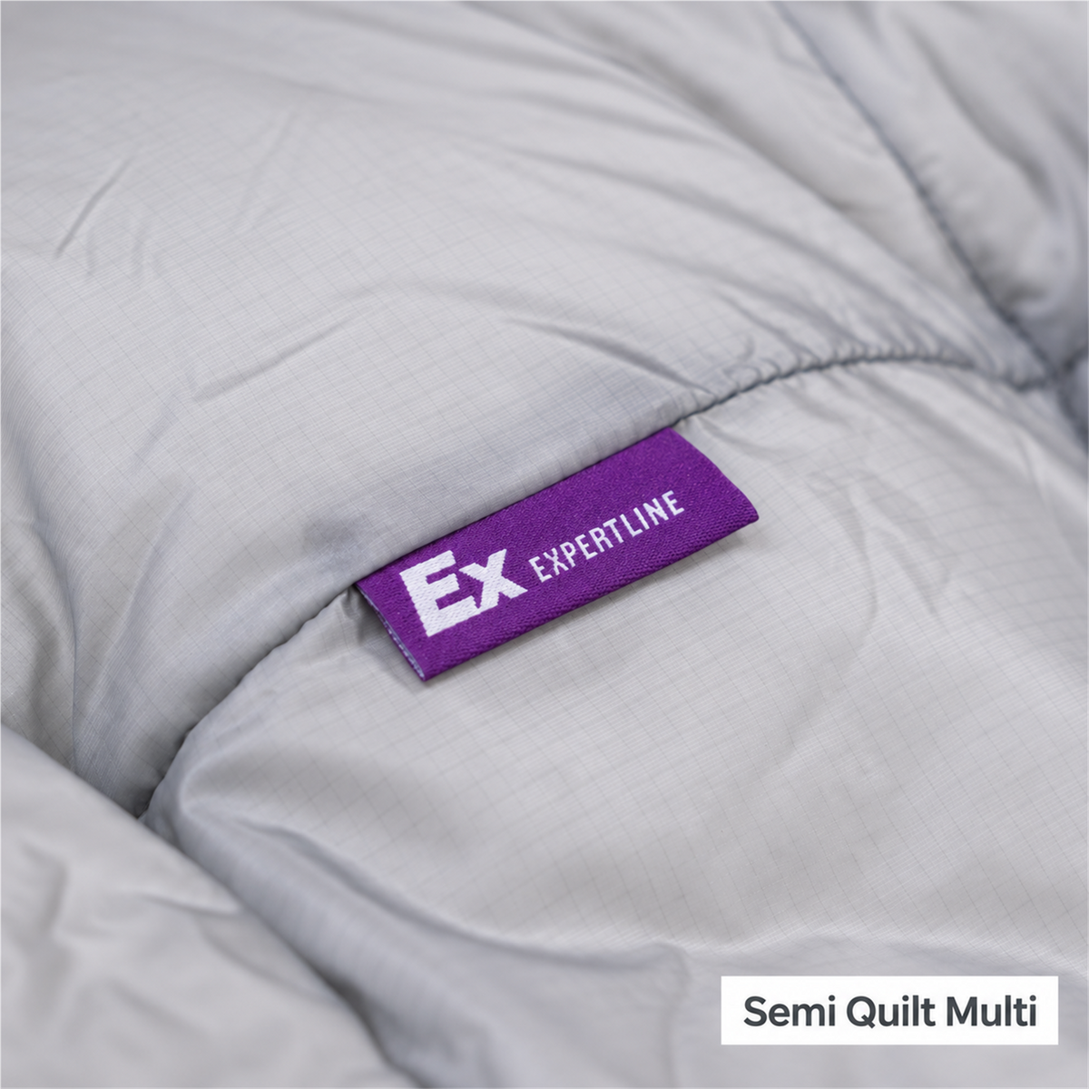 Close-up of Iceflame EX Expertline label on the insulated quilt