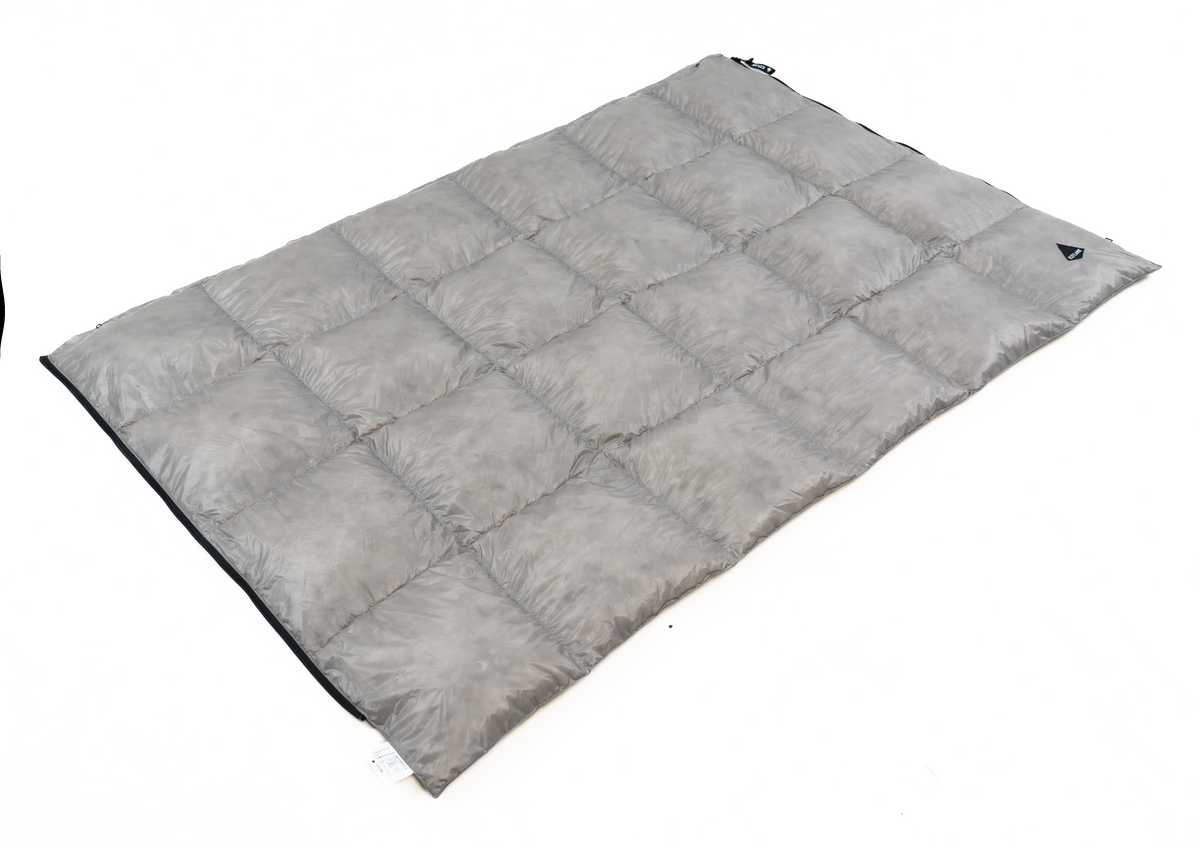 Iceflame NXT down blanket in grey angled flat lay