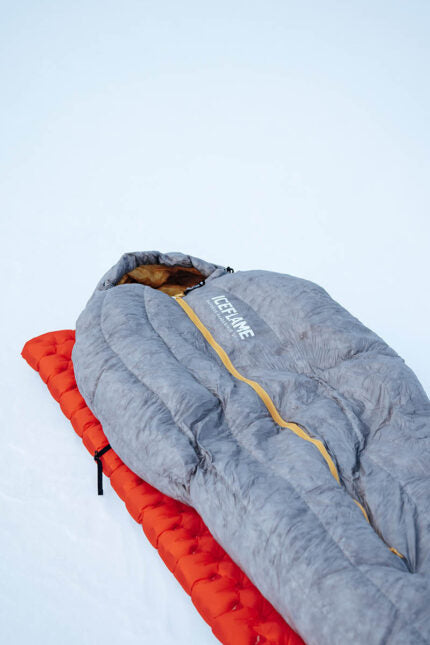 Iceflame Flame NXT winter sleeping bag – on red sleep mat